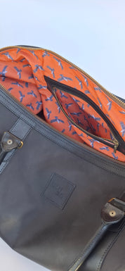 Bolso ULMMO Cuero Negro con forro cóndor naranjo