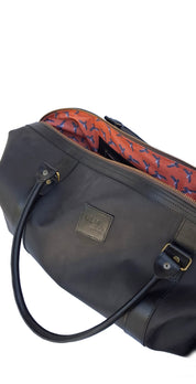 Bolso ULMMO Cuero Negro con forro cóndor naranjo