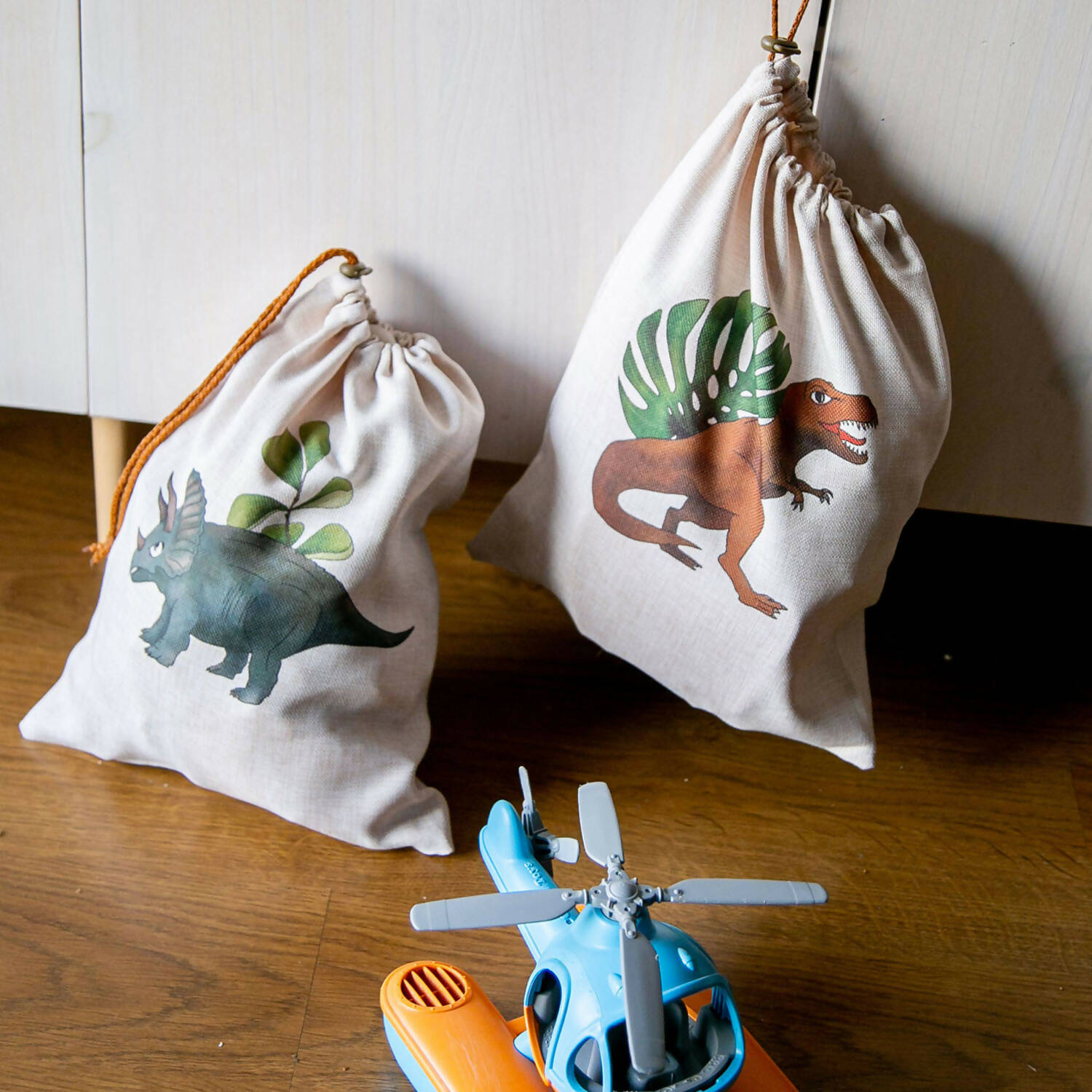Bolsa organizadora de juguetes infantiles y bebés diseño dinosaurio azul Paper Home